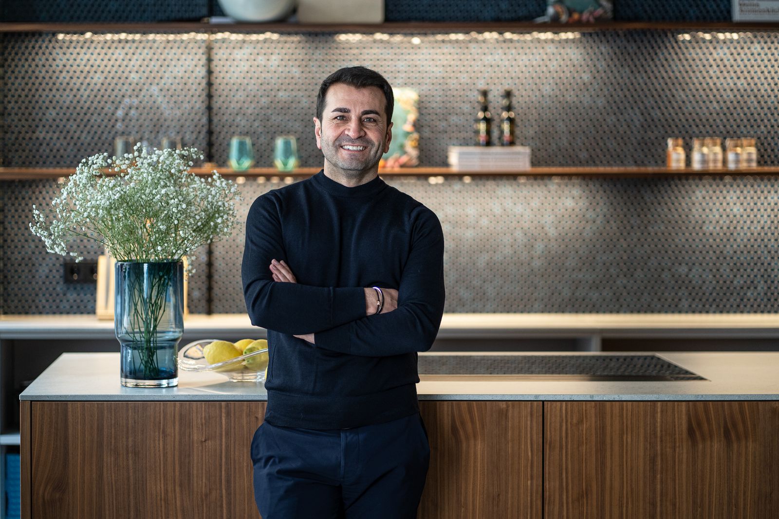 Ali Güngörmüş in front of his next125 kitchen