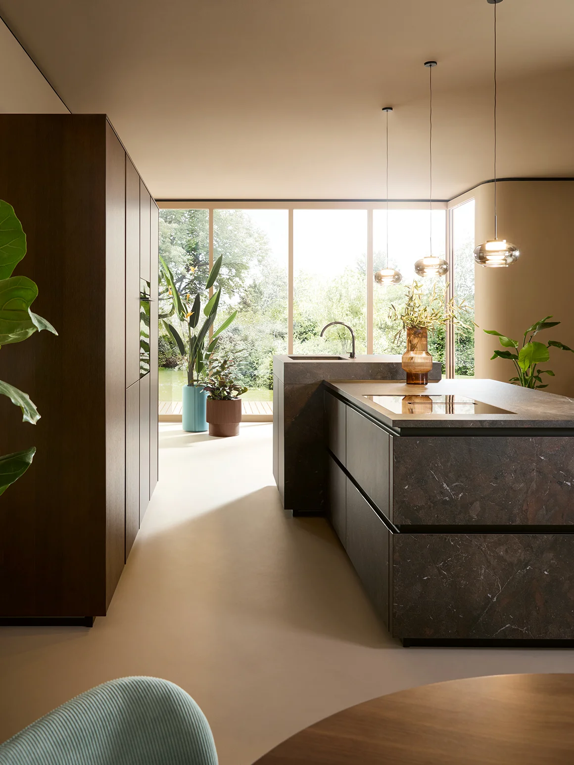 Ceramic cooking island and wooden tall unit 