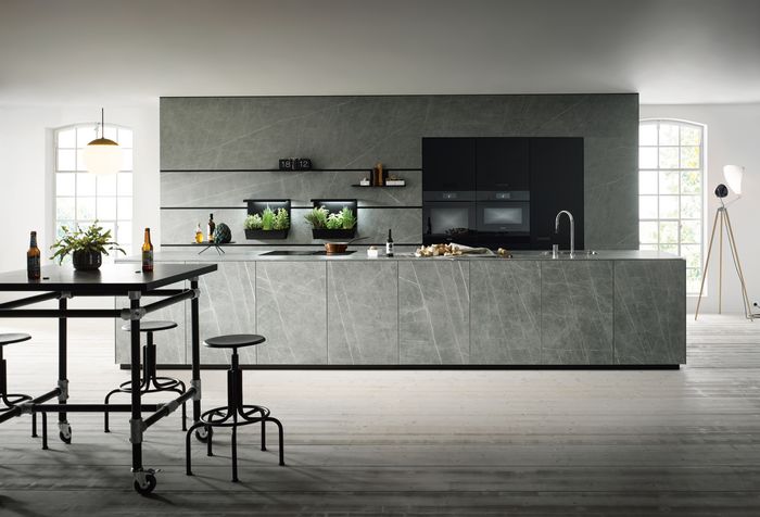 marble style kitchen with a dinning table 