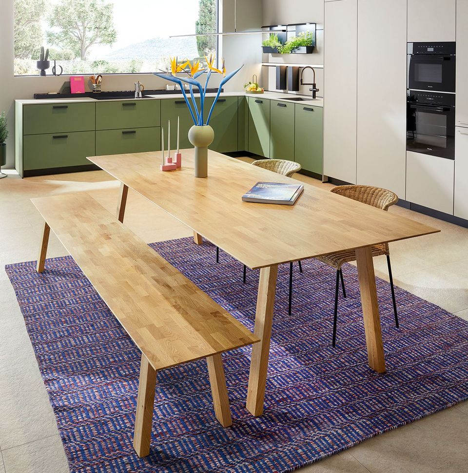 wooden table and pendant luminaires